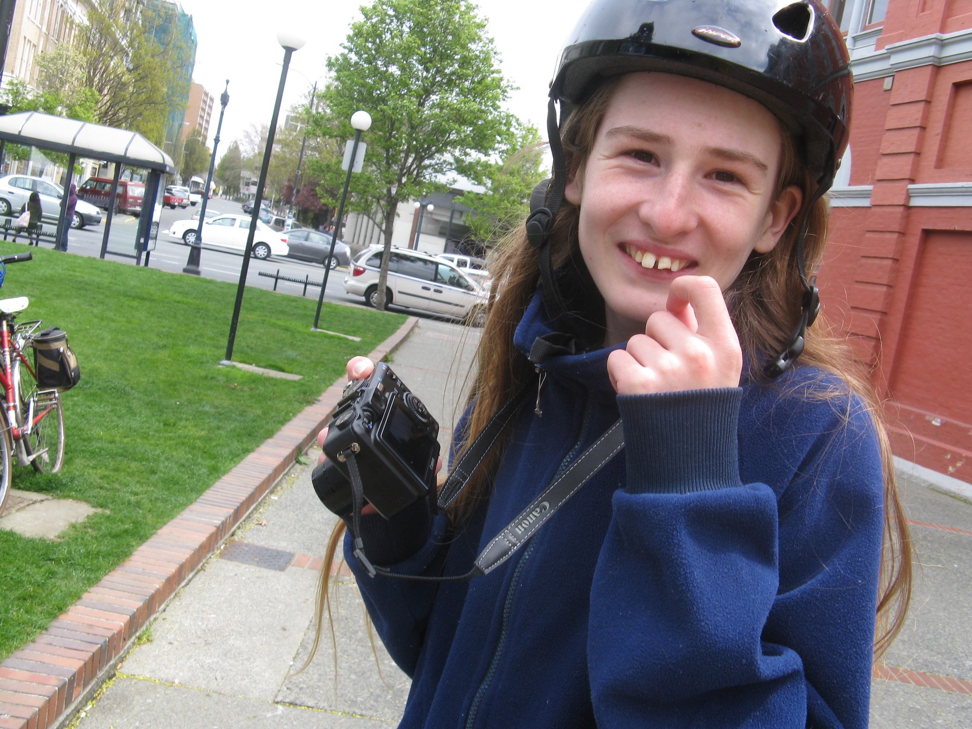a student cyclist takes pictures on a school field trip
